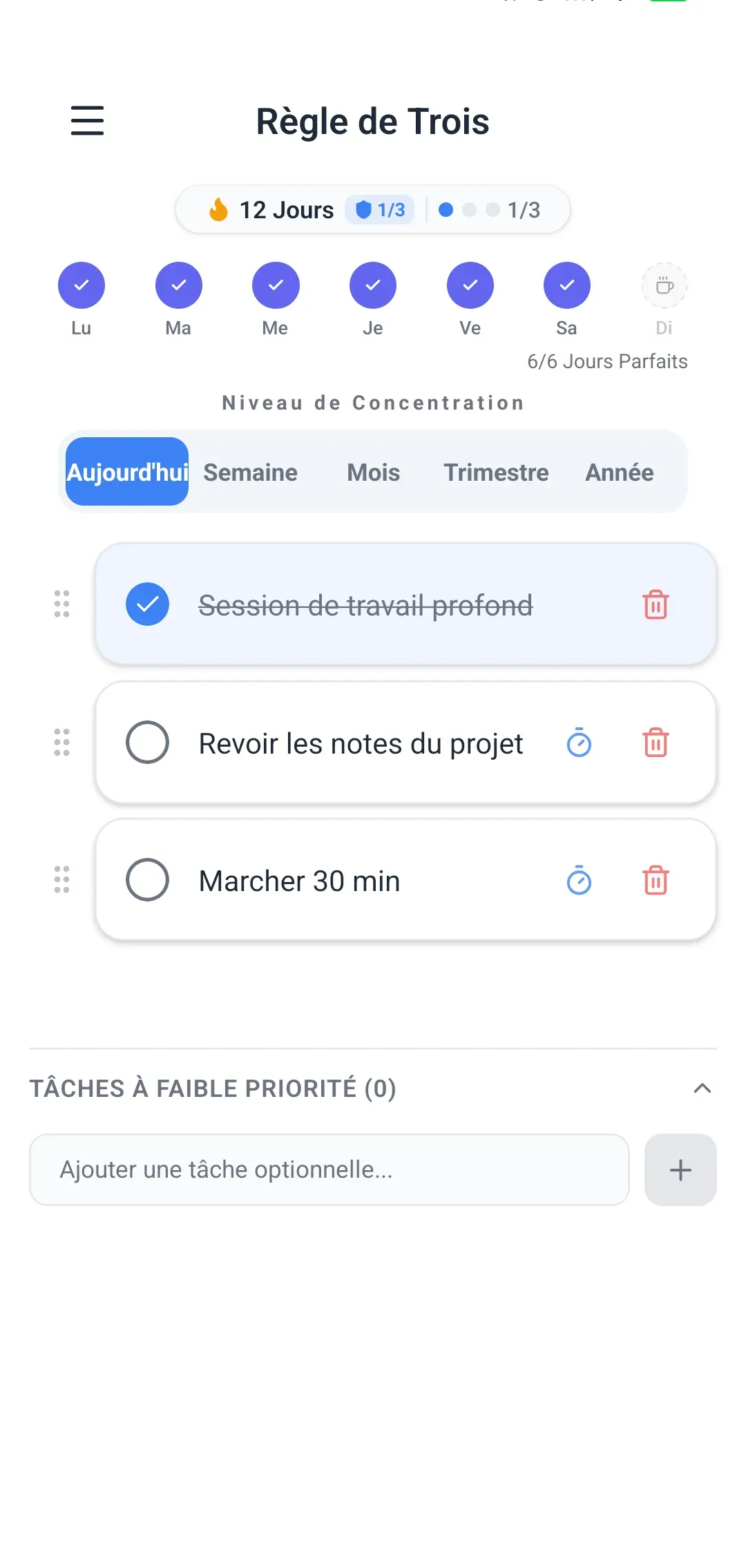 Interface de l’application Rule of Three montrant 3 objectifs quotidiens, le niveau de concentration et la progression