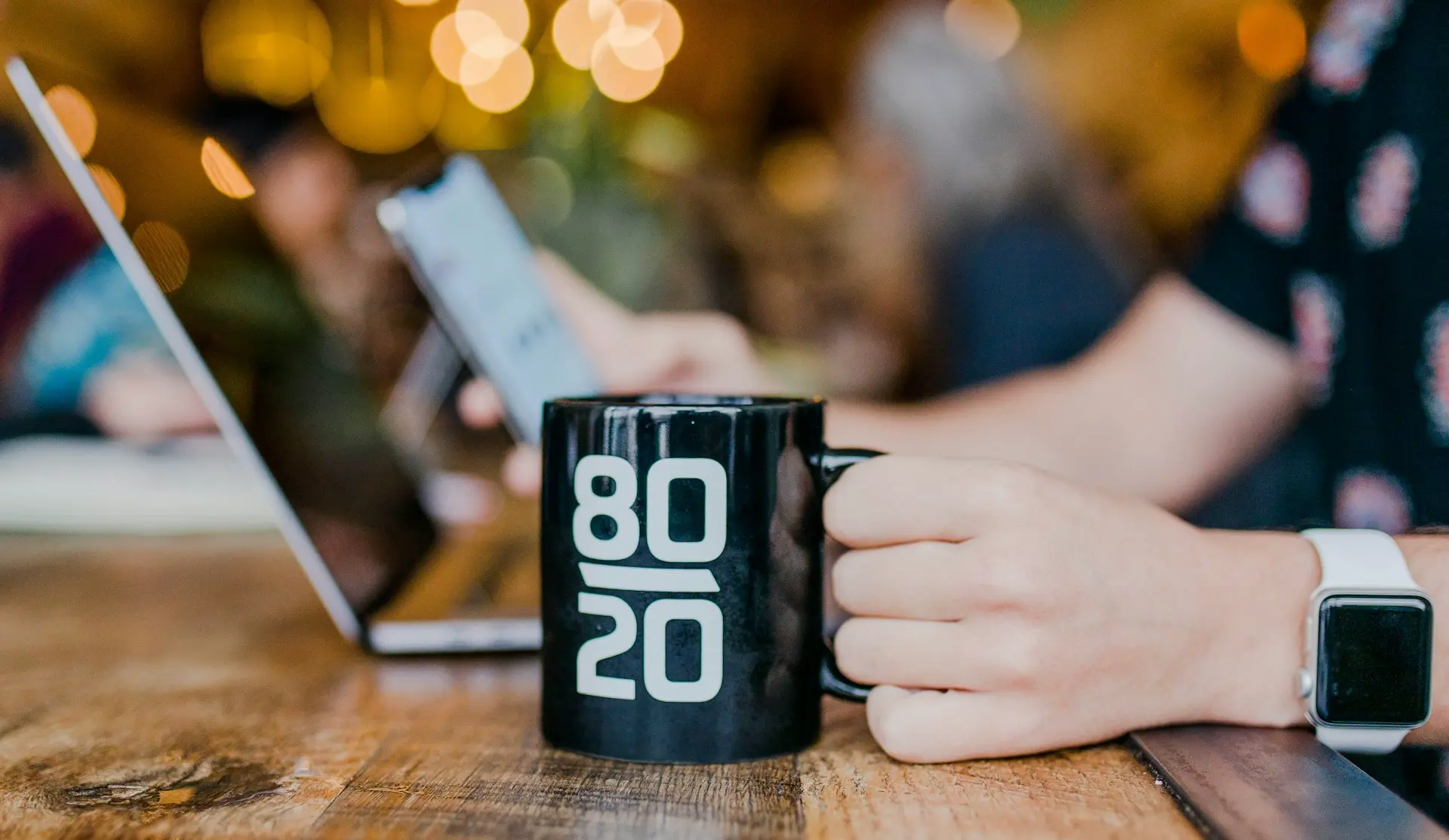 Coffee mug with 80 / 20 text representing the Pareto Principle